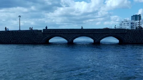 Tourists stroll around Arrecife de Lanzarote Stock Footage 257821407