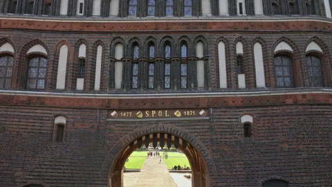 Tourists strolling at the Holsten Gate, the gateway to the old town of Lübeck Stock Footage 162350676
