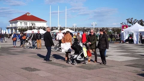 Tourists Strolling in the main square Skwer Kuracyjny on a pier in Sopot Stock Footage 72512418