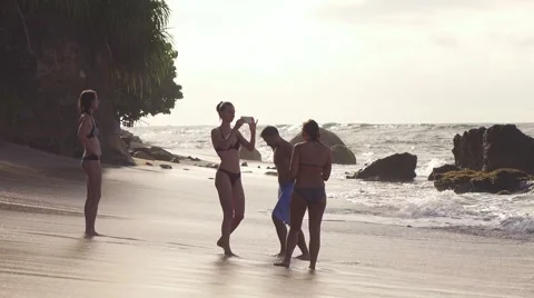 Tourists swiming in ocean and get a photo Stock Footage 58317269