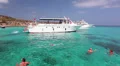Tourists swimming in the blue lagoon, jumping from the deck, Latchi, Cyprus HD Footage