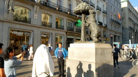 Tourists taking photos at the bear statue symbol of Madrid Spain Stock Footage 117333003