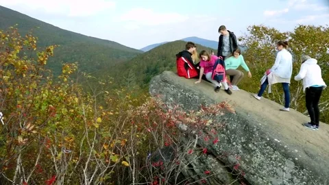Tourists on top of the mountain  Stock Footage 77705905