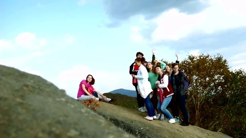 Tourists on top of the mountain  Stock Footage 77705933