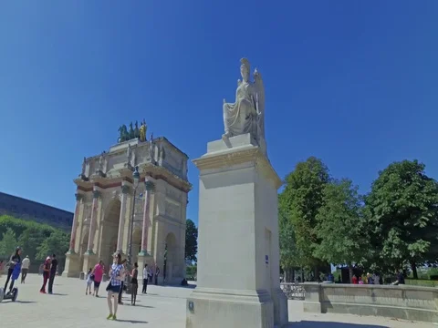 Tourists in Triumphal Arch (Arc de Triomphe du Carrousel) at Tuileries gardens. Stock Footage