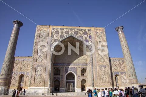 Tourists at Ulug Beg Madrasa, The Registan, Samarkand, Uzbekistan Stock Photos