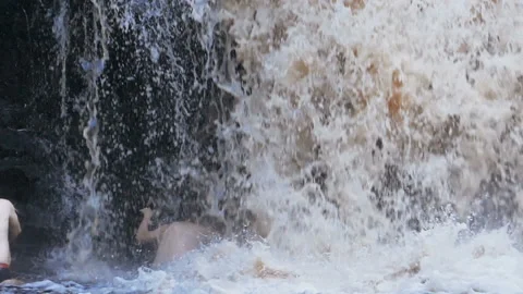 Tourists under Waterfall Stock Footage 125976352