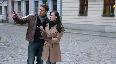 Tourists using tablet computer for navigation Stock Footage 33528876