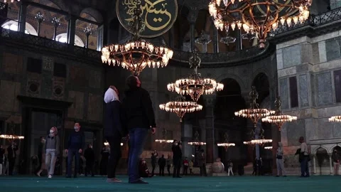 Tourists view the interior and dome of the Hagia Sophia. Stock Footage 150211545