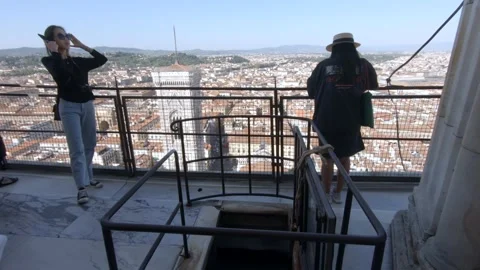Tourists viewing down the cityscape from top of Florence Cathedral, Italy Stock Footage 141816111