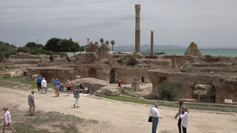 Tourists visit Carthage ruins, historic landmark and heritage Tunisia Africa Stock Footage 334377953