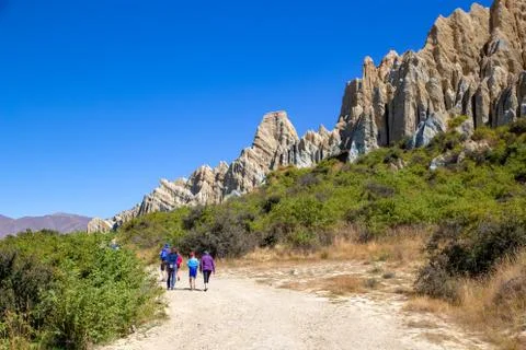 Tourists visit the Clay Cliffs in New Zealand Stock Photos