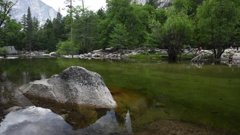 Tourists visit Mirror Lake below El Capitan Stock Footage 319514358