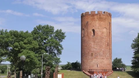 . tourists visit the old brick tower called white tower Stock Footage 197851972