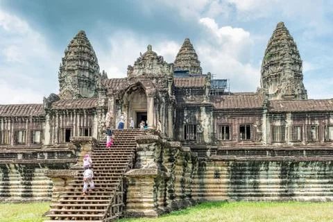 Tourists visiting Angkor Wat temple complex in Cambodia. Stock Photos