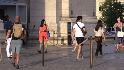 Tourists visiting the Arc de Triomphe on the Place de l'Etoile square in Paris Stock Footage 127632911