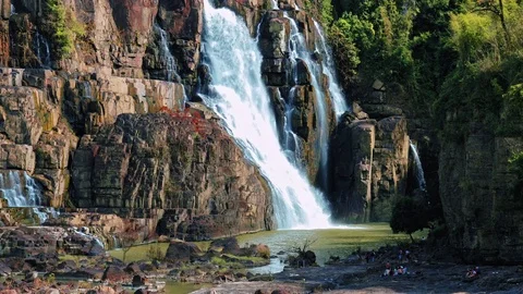 Tourists visiting beautiful waterfall. Stock Footage 72699893