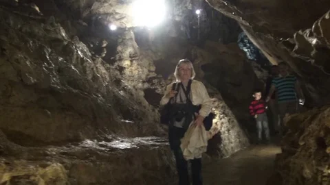 Tourists visiting the cave Mencilis Stock-Footage 69885897