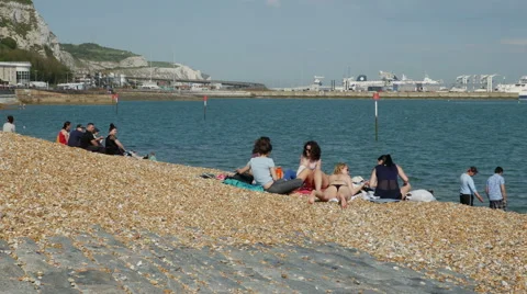 Tourists visiting Dover Harbour Beach Stock Footage 64104751