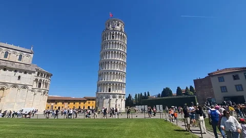 Tourists visiting the famous leaning Tower of Pisa on a sunny day Stock Footage 344690266