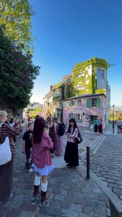 Tourists visiting La Maison Rose in Montmartre, Paris Stock Footage 337783841