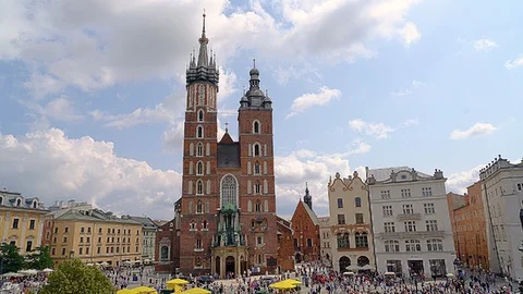 Tourists visiting the main square in the center of Krakau Stock Footage 90358442