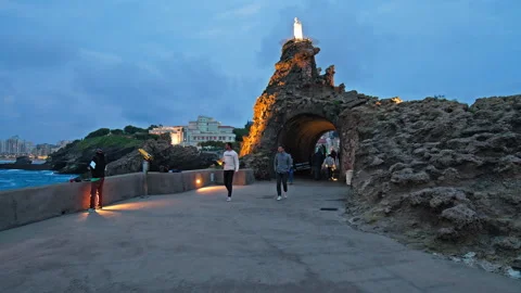 Tourists visiting the Rock of the Virgin, in the evening in Biarritz, France. Stock Footage 247222399
