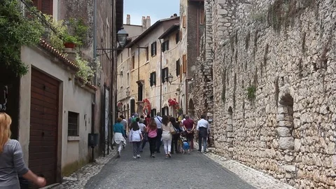Tourists visiting small ancient town Sermoneta. Stock Footage 124667172