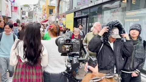 Tourists Vlogging with Camera Gimbal on Crowded Takeshita Street in Tokyo Video stock 331420758