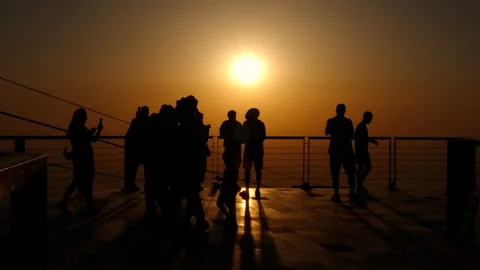Tourists wait for cable car to evening travel. Stock Footage 287132420