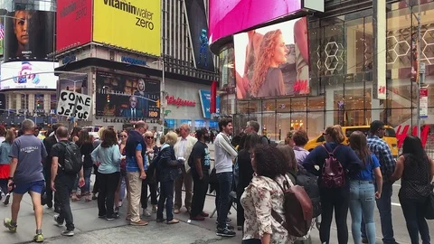 Tourists Wait On Line for Sightseeing Bus in New York's Times Square Stock Footage 76976216