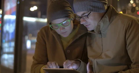 Tourists Waiting for a Bus with Tablet PC Stock Footage 57229864