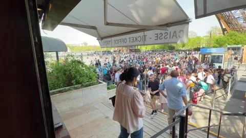 Tourists waiting in long queue for Eiffel Tower tickets Stock Footage 334106741