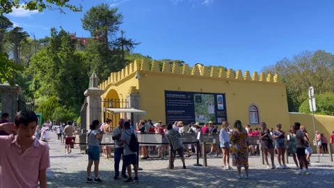 Tourists waiting on a queue to access the National Palace of Pena in Sintra Video stock 220450623
