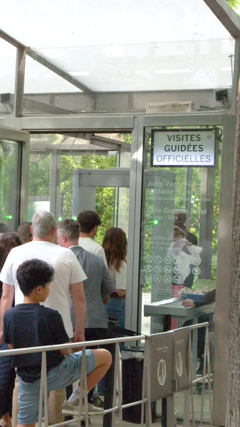 Tourists Waiting in Security Checkpoint Line at Paris Landmark Entrance Stock Footage 334711092