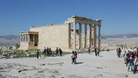 Tourists walk and explore the ancient Acropolis Stock Footage 98494504