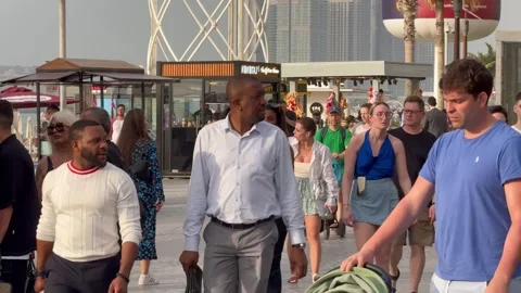 Tourists walk in the area of ​​The Beach JBR. Dubai UAE 29 August 2026. Stock Footage 343692162
