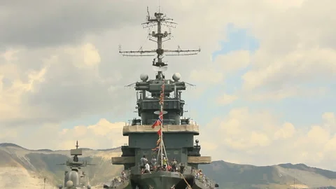Tourists walk on the deck of a warship Stock Footage 149253376