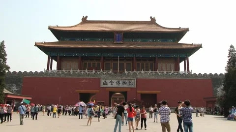 Tourists walk in front of the gate of the Gugun palace in Beijing, China. Stock Footage 66765013