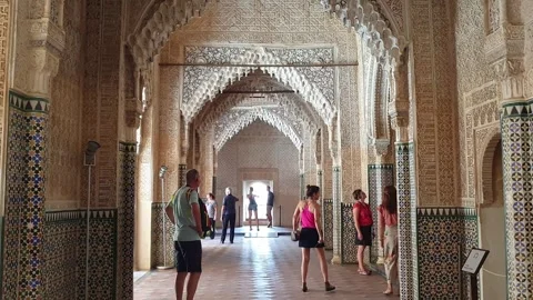Tourists walk at hall of kings in alhambra, granada, spain, zoom in Stock Footage 280852953