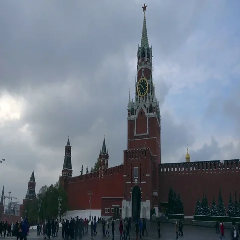 Tourists walk on Red Square on the background of the Kremlin Stock Footage 69450308