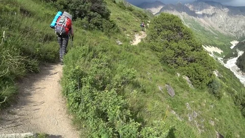 Tourists walking along the mountain trail Stock Footage 80757895