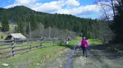 Tourists walking along old abandoned farm in forest Stock Footage 50074635