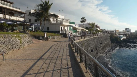 Tourists Walking Along Seafront La Caleta Tenerife Spain Stock Footage 104394650