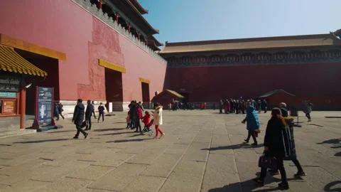 Tourists Walking and Gathering in Courtyard Beside Red Walls, Forbidden City Stock Footage 345831153