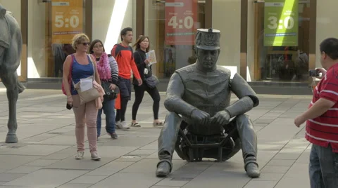 Tourists walking and taking pictures of the Monumental break sculpture, Vienna Stock Footage 59181221