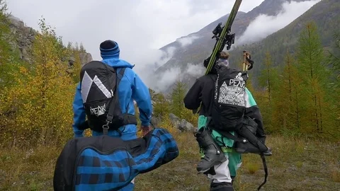 Tourists walking with backpack in forest area Stock-Footage 77806674