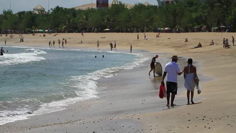 Tourists walking On Bali Beach Stock Footage 146936151