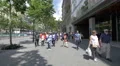 Tourists walking in Barcelona near Longchamp and Prada stores 4k or 4k+ Resolution