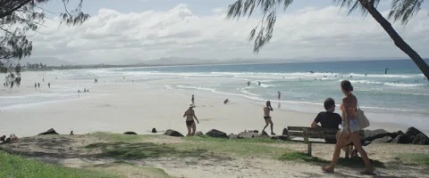 Tourists walking on beach Stock Footage 67020428